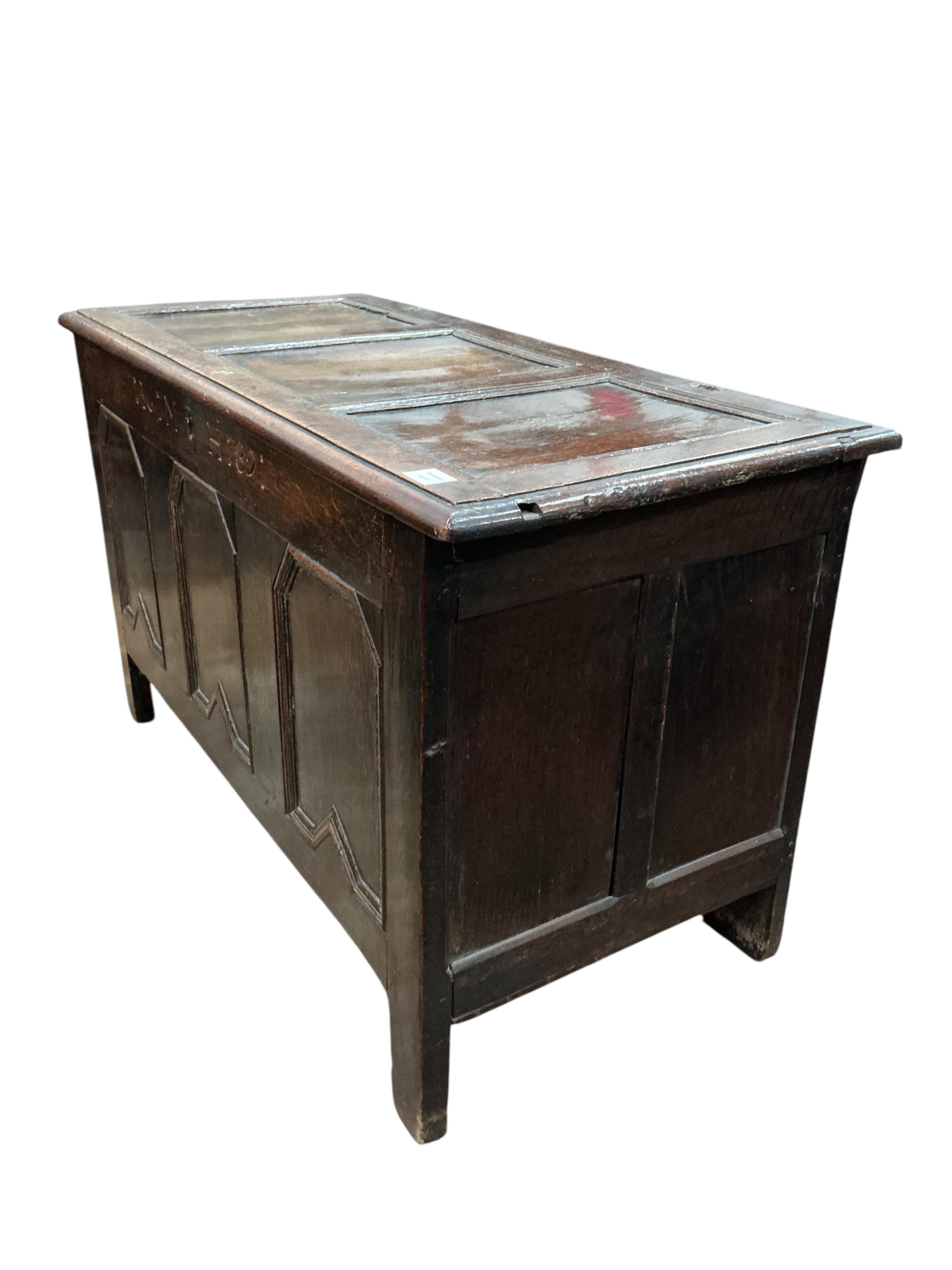A late 17th century panelled oak coffer, dated 1686, width 116cm, depth 54cm, height 71cm